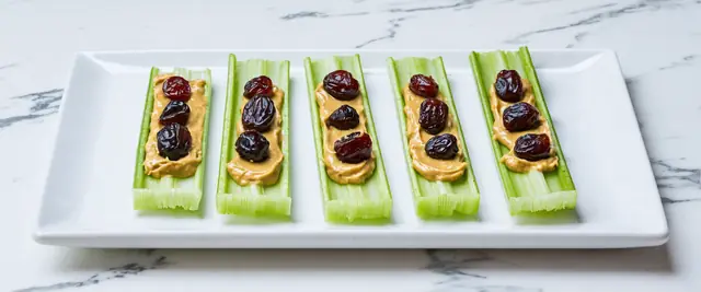Celery Sticks with Peanut Butter and Raisins (“Ants on a Log”)