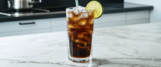 Classic Dirty Soda Made with Diet Coke, Coconut Syrup, Lime Juice, and Cream
