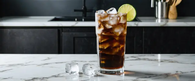 Dirty Dr Pepper Made with Dr Pepper, Coconut Cream, and Lime Juice